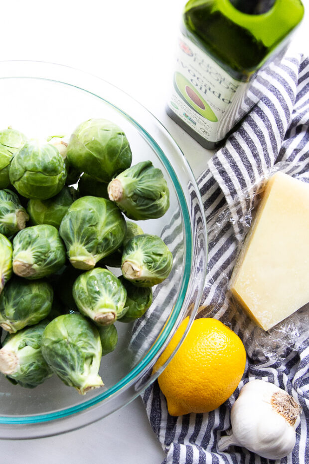 Ingredients for Crispy Shredded Brussels Sprouts - Brussels sprouts, oil, parmesan, lemon, and garlic.