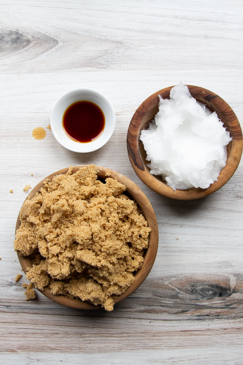 Ingredients for body scrub: brown sugar, coconut oil, and vanilla.