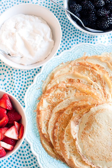 Learn all the tips and tricks for making paper-thin, delicious crepes that are GLUTEN-FREE! They're easily made dairy-free as well and can be filled with your favorite sweet or savory things. | perrysplate.com #glutenfreerecipes #crepes 
