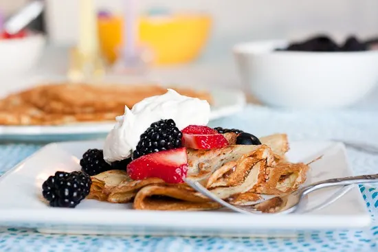learn all the tips and tricks for making paper-thin, delicious crepes that are GLUTEN-FREE! They're easily made dairy-free as well and can be filled with your favorite sweet or savory things. | perrysplate.com #glutenfreerecipes #crepes 