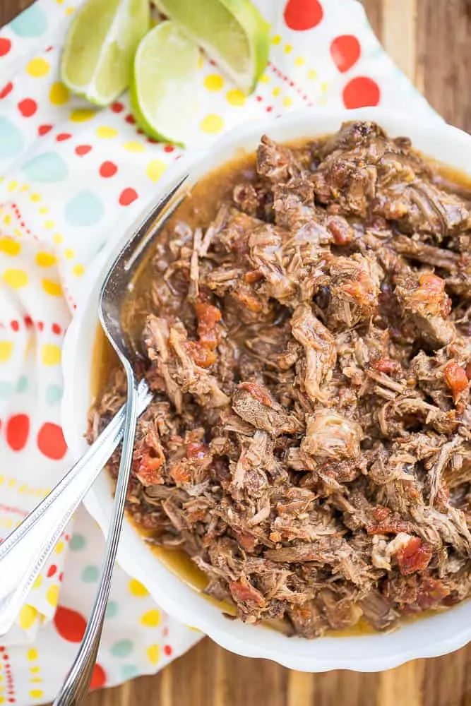 Make this chipotle shredded beef in your slow cooker or Instant Pot! It's a perfect meal prep recipe to give you a head start on weeknight dinners. Chipotle Shredded Beef for Slow Cooker or Instant Pot | slow cooker recipes | Instant Pot recipes | paleo recipes | keto recipes | gluten-free recipes | meal prep recipes | perrysplate.com