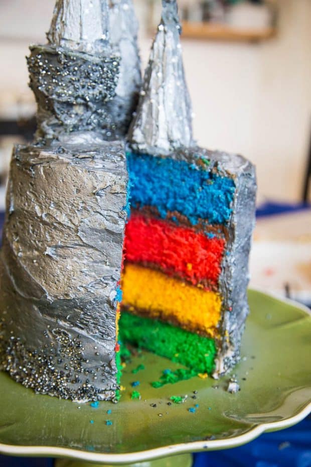 View from inside the cut cake showing 4 different colored layers -- one for each Hogwarts house.