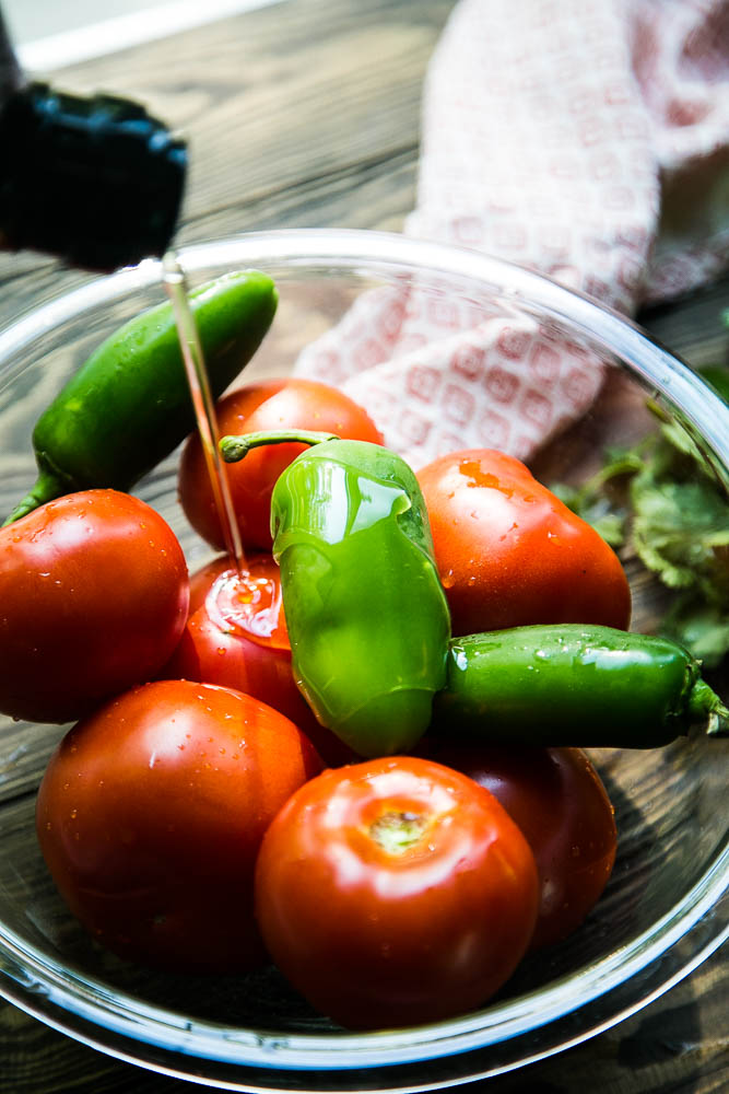 Summer tomatoes getting ready to be made into homemade salsa! | perrysplate.com