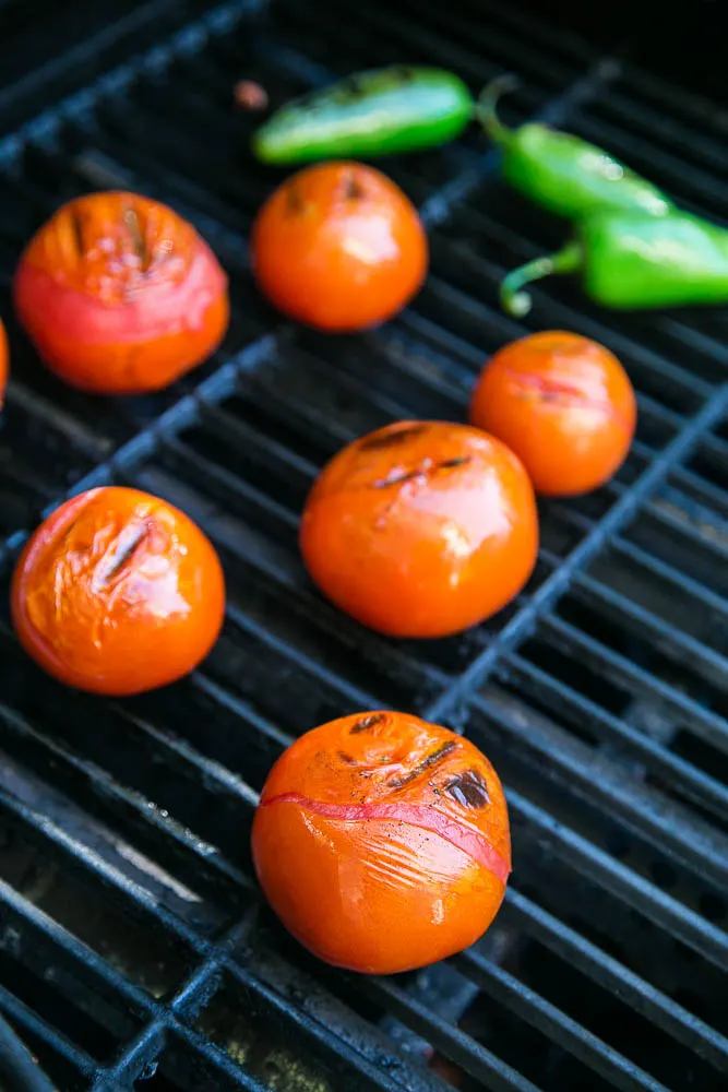 Grilled tomatoes and jalapenos for homemade Smoky Grilled Salsa | Perrysplate.com #salsarecipe