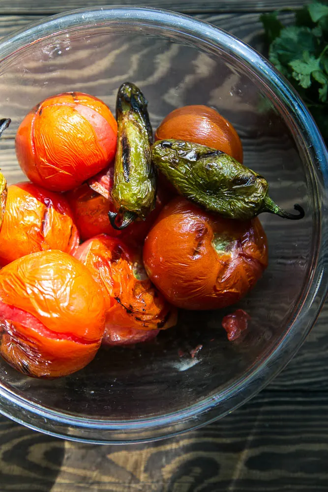 Grilled tomatoes and jalapenos for homemade Smoky Grilled Salsa | Perrysplate.com #salsarecipe
