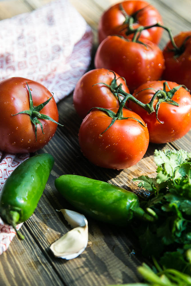 Summer tomatoes getting ready to be made into homemade salsa! | perrysplate.com