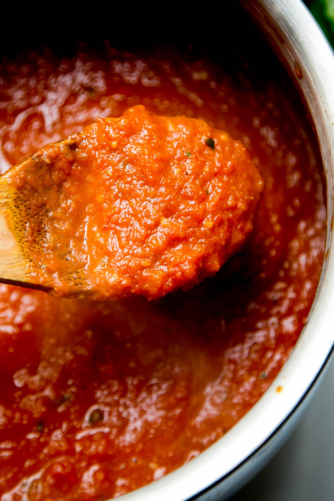 This easy Balsamic Roasted Tomato Sauce is totally delicious and versatile! Use it in any recipe that calls for marinara or on pizza. | perrysplate.com #tomatorecipes #tomatosauce