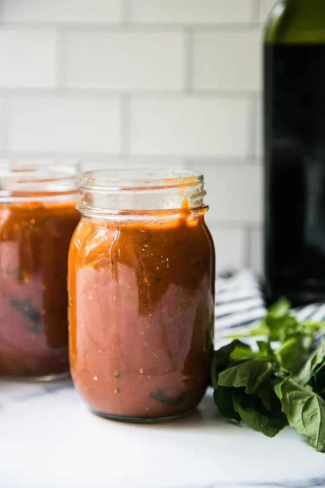 This easy Balsamic Roasted Tomato Sauce is totally delicious and versatile! Use it in any recipe that calls for marinara or on pizza. | perrysplate.com #tomatorecipes #tomatosauce This easy Balsamic Roasted Tomato Sauce is totally delicious and versatile! Use it in any recipe that calls for marinara or on pizza. | perrysplate.com #tomatorecipes #tomatosauce