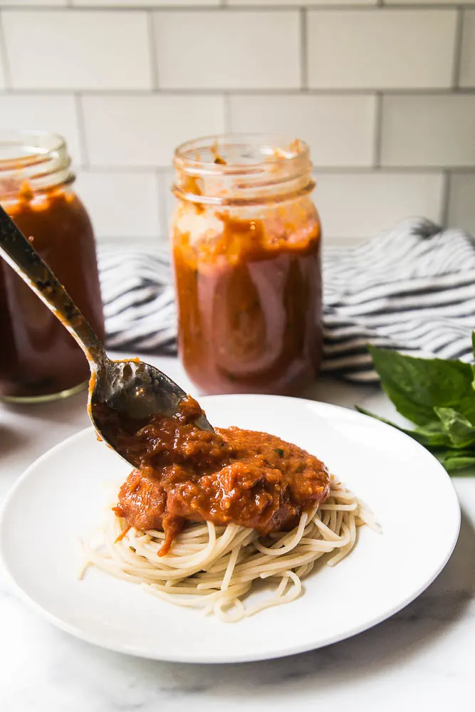 This easy Balsamic Roasted Tomato Sauce is totally delicious and versatile! Use it in any recipe that calls for marinara or on pizza. | perrysplate.com #tomatorecipes #tomatosauce