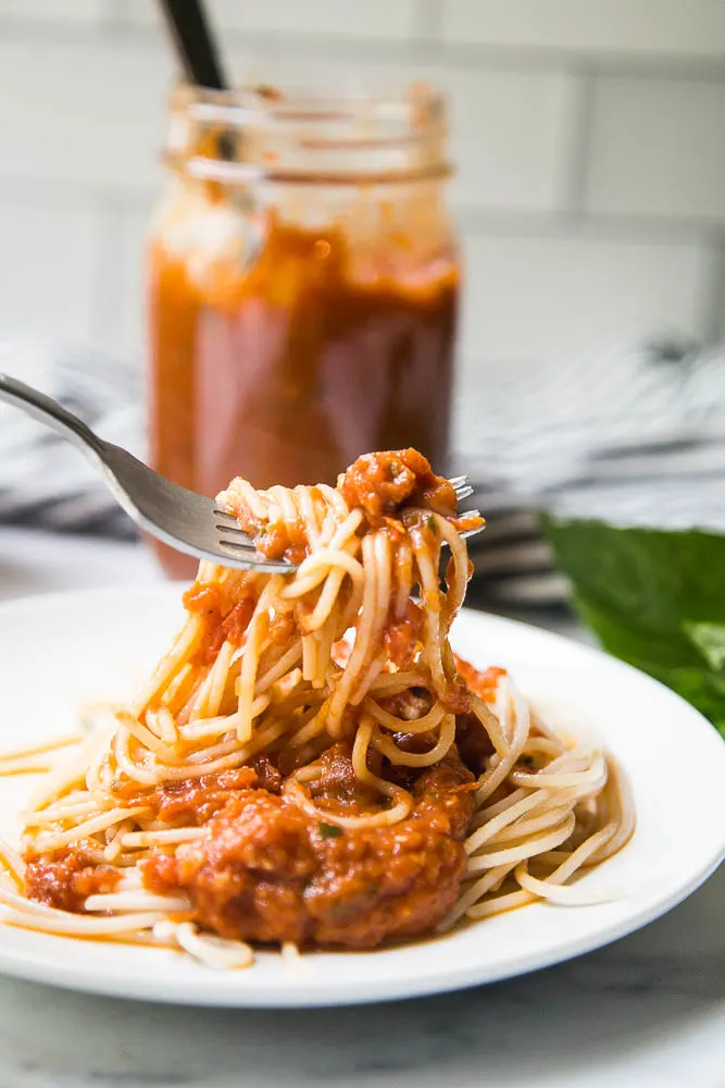 This easy Balsamic Roasted Tomato Sauce is totally delicious and versatile! Use it in any recipe that calls for marinara or on pizza. | perrysplate.com #tomatorecipes #tomatosauce