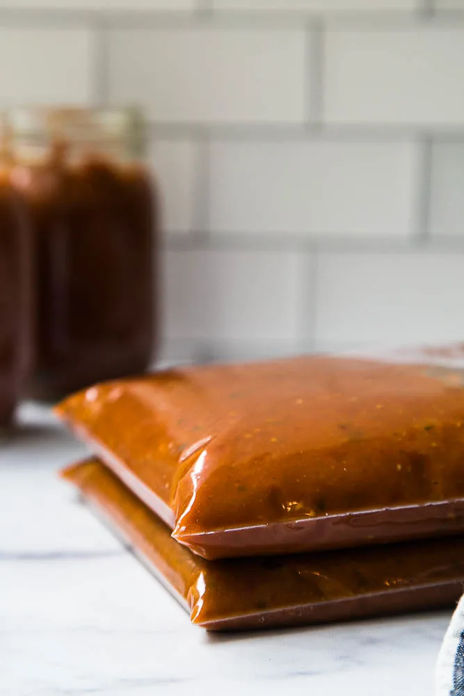 This easy Balsamic Roasted Tomato Sauce is totally delicious and versatile! Use it in any recipe that calls for marinara or on pizza. | perrysplate.com #tomatorecipes #tomatosauce This easy Balsamic Roasted Tomato Sauce is totally delicious and versatile! Use it in any recipe that calls for marinara or on pizza. | perrysplate.com #tomatorecipes #tomatosauce