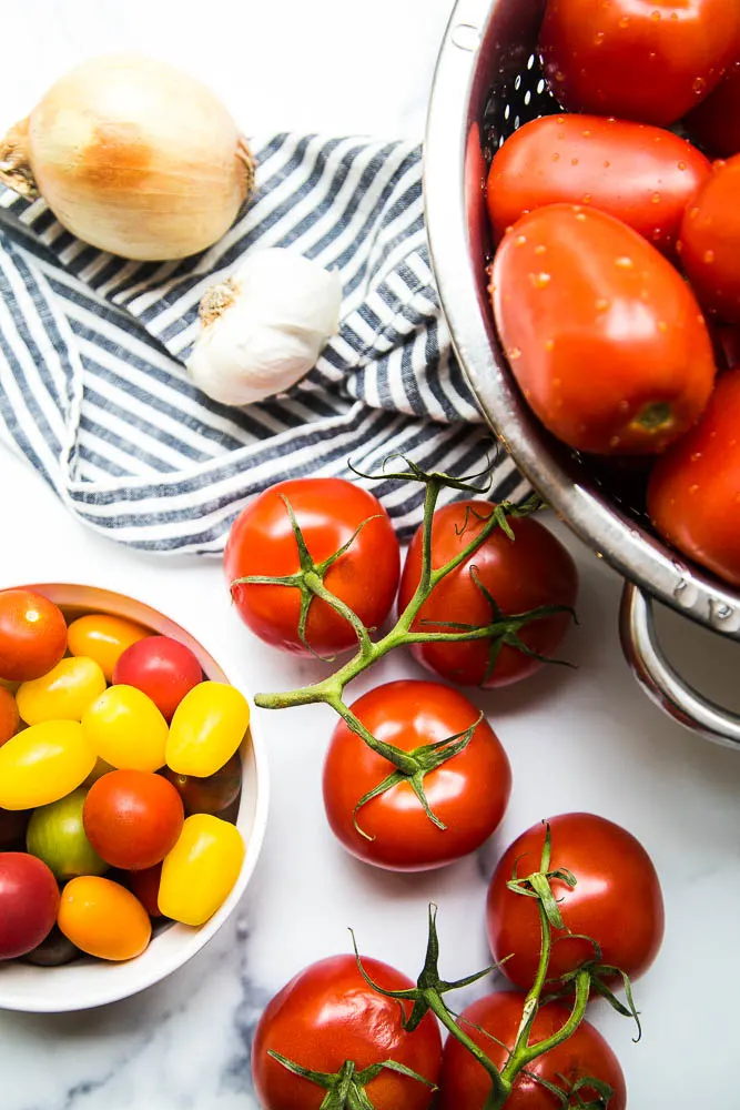 This easy Balsamic Roasted Tomato Sauce is totally delicious and versatile! Use it in any recipe that calls for marinara or on pizza. | perrysplate.com #tomatorecipes #tomatosauce This easy Balsamic Roasted Tomato Sauce is totally delicious and versatile! Use it in any recipe that calls for marinara or on pizza. | perrysplate.com #tomatorecipes #tomatosauce