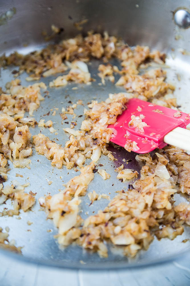 Caramelizing onions is an important step in making Egg Curry A skillet of caramelized diced onions.