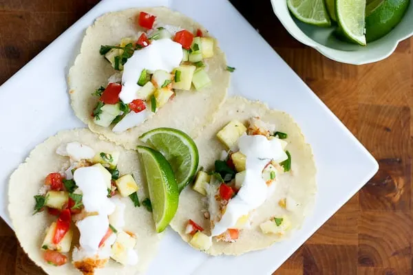 Tropical Fish Tacos with Pineapple Salsa Tropical Fish Tacos with Pineapple Salsa | fish taco recipes | gluten-free recipes | tex-mex recipes | pineapple recipes | perrysplate.com