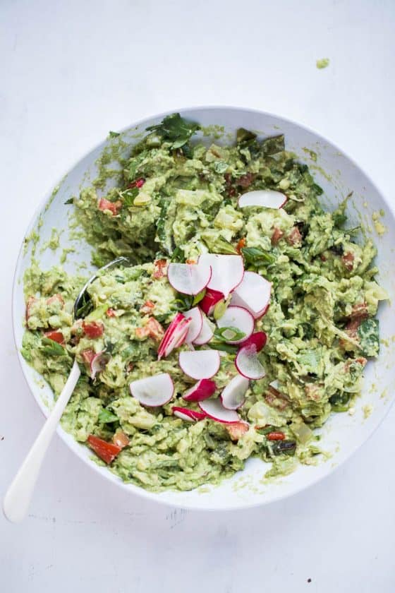 You haven't lived until you've had roasted chiles in your guacamole. Grab this recipe for Loaded Roasted Chile Guacamole! | guacamole recipes | perrysplate.com