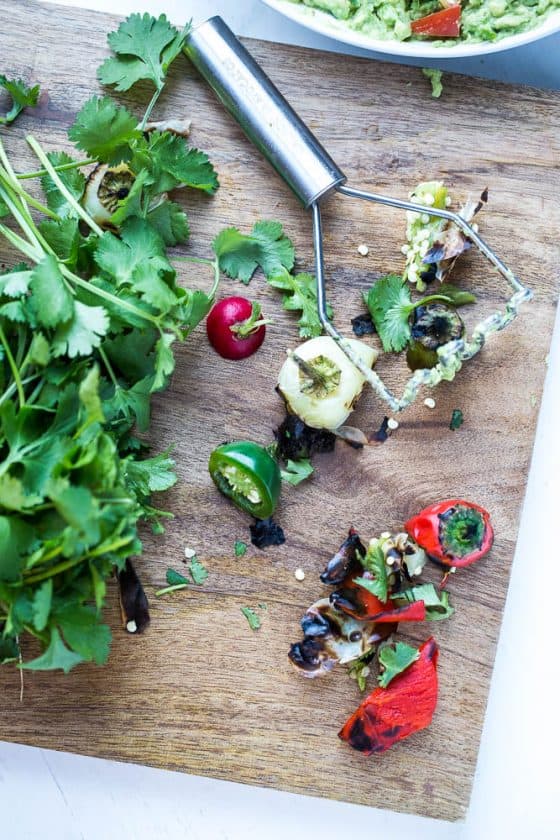 You haven't lived until you've had roasted chiles in your guacamole. Grab this recipe for Loaded Roasted Chile Guacamole! | guacamole recipes | perrysplate.com