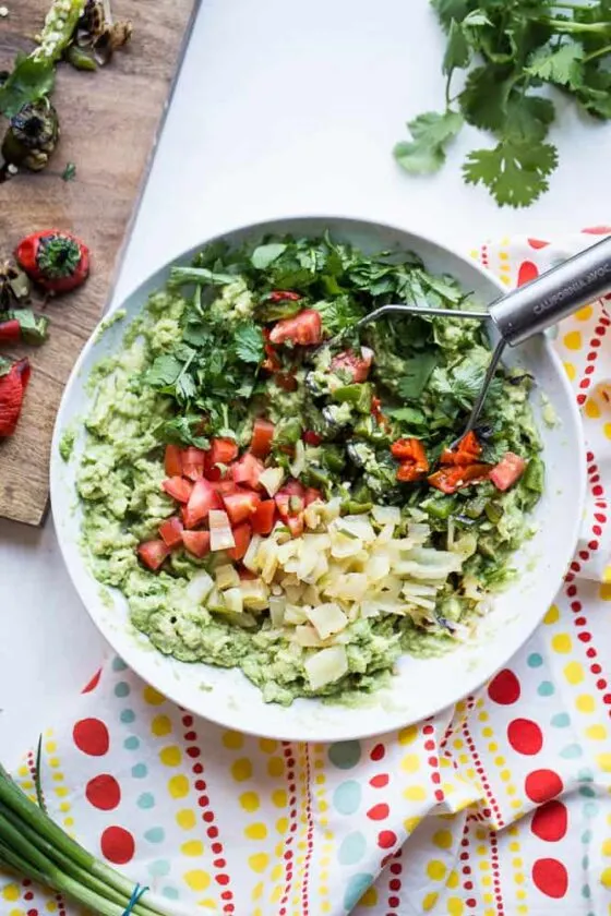 You haven't lived until you've had roasted chiles in your guacamole. Grab this recipe for Loaded Roasted Chile Guacamole! | guacamole recipes | perrysplate.com You haven't lived until you've had roasted chiles in your guacamole. Grab this recipe for Loaded Roasted Chile Guacamole! | guacamole recipes | perrysplate.com