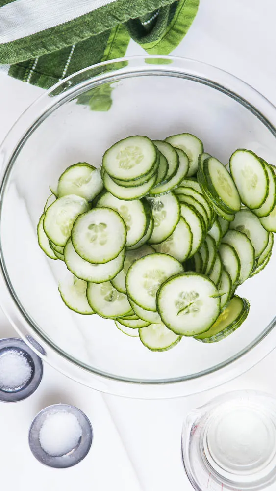 Simple Marinated Cucumbers aka Cucumbers & Vinegar is a crazy easy and fast side dish that goes with most everything! Plus they last a long time in the fridge for snacking. | perrysplate.com #cucumbersandvinegar #quickpickle