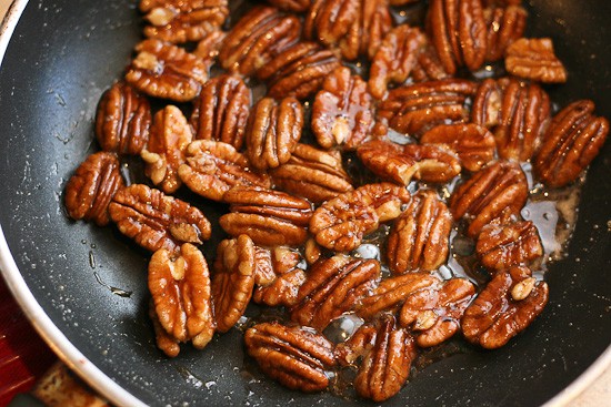 Make these 5-Minute Maple-Ginger Glazed Pecans and throw them on a salad or serve them as a quick little treat at a party! | pecan recipes | paleo recipes | salad toppings | - www.PerrysPlate.com