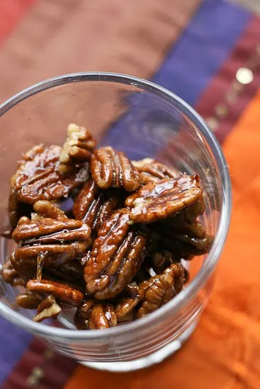 Make these 5-Minute Maple-Ginger Glazed Pecans and throw them on a salad or serve them as a quick little treat at a party! | pecan recipes | paleo recipes | salad toppings | - www.PerrysPlate.com