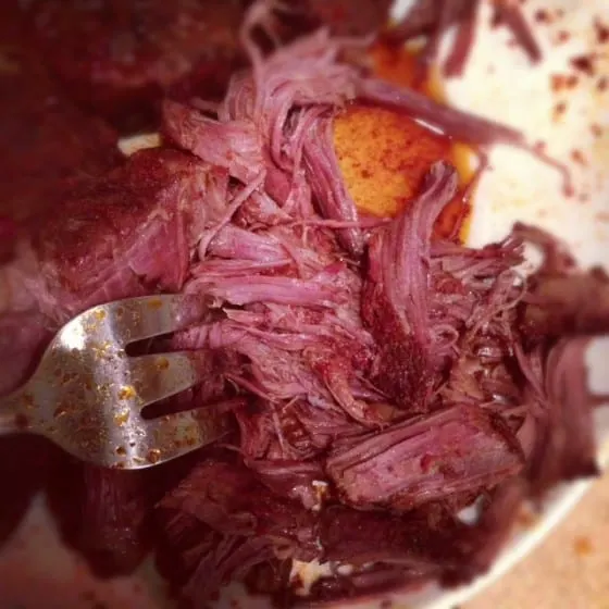 If you love that drippy, flavorful shredded beef in tacos from those hole-in-the-wall places, you HAVE to try this. It's easy to make a big batch of this shredded beef in your slow cooker! | perrysplate.com If you love that drippy, flavorful shredded beef in tacos from those hole-in-the-wall places, you HAVE to try this. It's easy to make a big batch of this shredded beef in your slow cooker! | perrysplate.com