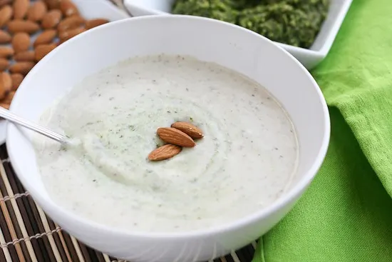 Garlic-Almond Soup with Basil-Almond Pesto -- a silky, creamy soup that won't leave you feeling heavy! perrysplate.com