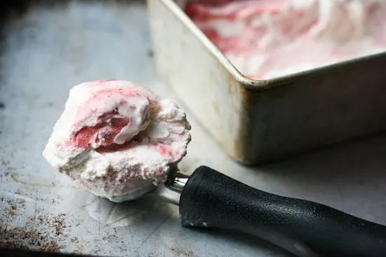 Have you ever roasted strawberries? It makes such a lovely swirl for this sweet and gingery ice cream that is naturally sweetened and can easily be made dairy free! | perrysplate.com Have you ever roasted strawberries? It makes such a lovely swirl for this sweet and gingery ice cream that is naturally sweetened and can easily be made dairy free! | perrysplate.com