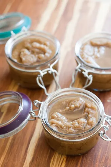 This homemade sugar scrub is a great DIY sugar scrub to use as a body exfoliator or a face scrub! You can also use salt or white sugar, too. Sugar scrub in glass jars. Oil has separated from the brown sugar some.