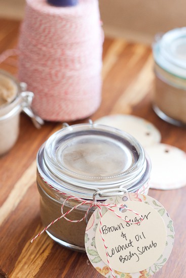 A small jar of brown sugar scrub with a tag for gift giving.