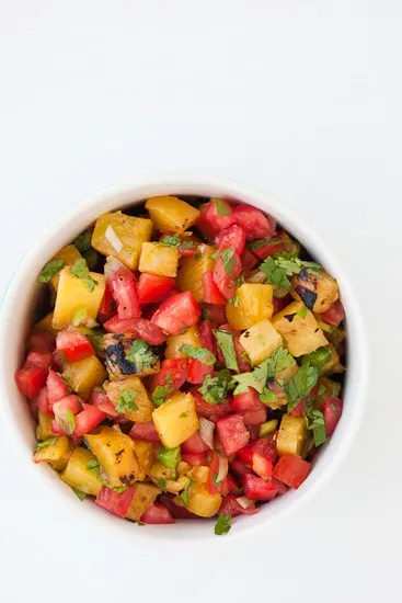Grilled Pineapple Salsa -- a sweet and spicy alternative to regular salsa and perfect on tacos or Mexican-inspired salads! | PerrysPlate.com Grilled Pineapple Salsa -- a sweet and spicy alternative to regular salsa and perfect on tacos or Mexican-inspired salads! | PerrysPlate.com