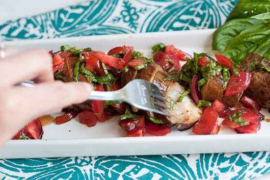 This is such a fun grilled vegetarian grilled dish! Garlic-studded eggplant turns silky soft when grilled for a long time and that slightly spicy tomato relish is the perfect topping! | perrysplate.com 
