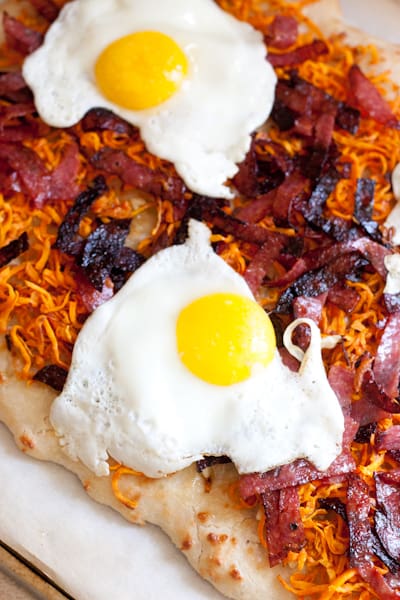 If you're a pizza-for-breakfast person you'll love this Grain-Free Breakfast Pizza topped with shredded roasted sweet potato hashbrowns, toasted salami, and drippy fried eggs. Oh, and cheese. It's not pizza without cheese. | PerrysPlate.com
