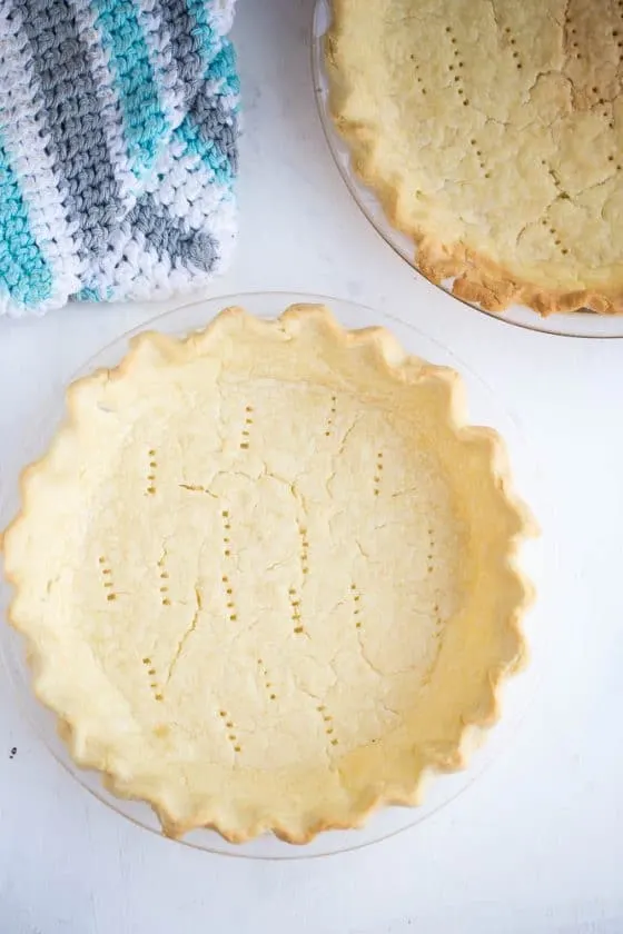 Pre-baked gluten-free pie crusts ready to be filled.