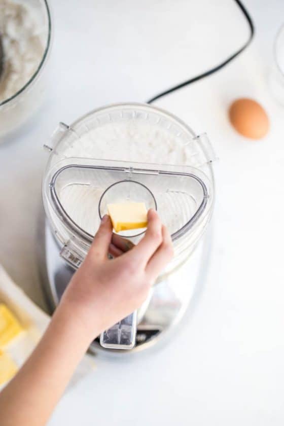 Perfect Gluten-Free Pie Crust -- Even better than most traditional pie crusts! | perrysplate.com | gluten-free recipes | gluten-free baking Adding cold butter to the gluten-free flour to make the pie crust dough.
