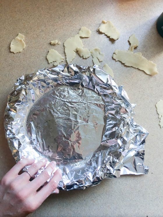 Perfect Gluten-Free Pie Crust -- Even better than most traditional pie crusts! | perrysplate.com | gluten-free recipes | gluten-free baking Pie crust dough covered with foil to prepare for baking. You can add pie weights here if you like.