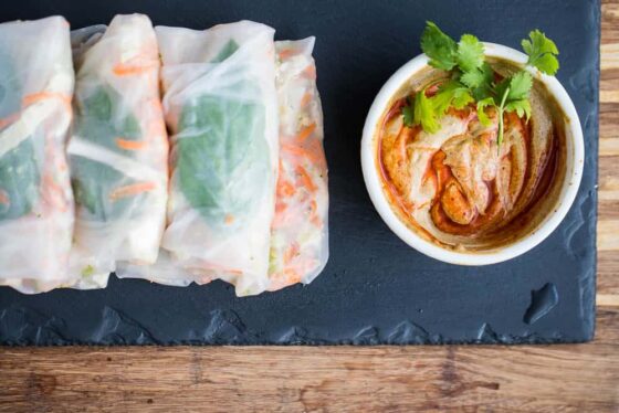 Thai Chicken Spring Rolls with Spicy "Peanut" Sauce -- A gluten-free and paleo-ish dinner that's great for a warm summer night. The Thai grilled chicken and nutty sauce are a winning combination! | paleo recipes | gluten-free recipes | perrysplate.com