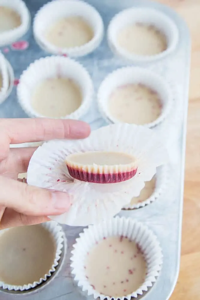 These keto friendly, sugar free fat bombs are the BEST little treat! The raspberry flavor is so strong and together they taste like a white chocolate raspberry truffle. Totally delicious. White Chocolate Raspberry Fat Bombs | The Everyday Ketogenic Kitchen | keto recipes | paleo recipes | dairy-free recipes | sugar free recipes | low carb recipes