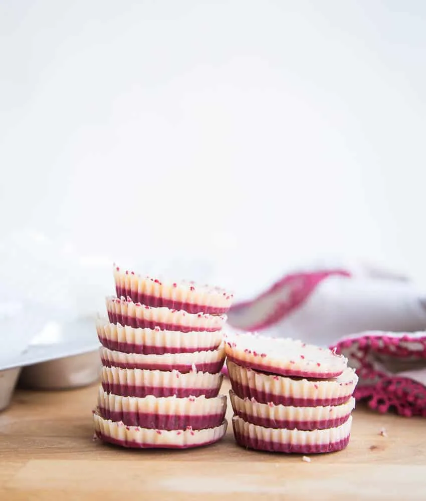 These keto friendly, sugar free fat bombs are the BEST little treat! The raspberry flavor is so strong and together they taste like a white chocolate raspberry truffle. Totally delicious. White Chocolate Raspberry Fat Bombs | The Everyday Ketogenic Kitchen | keto recipes | paleo recipes | dairy-free recipes | sugar free recipes | low carb recipes