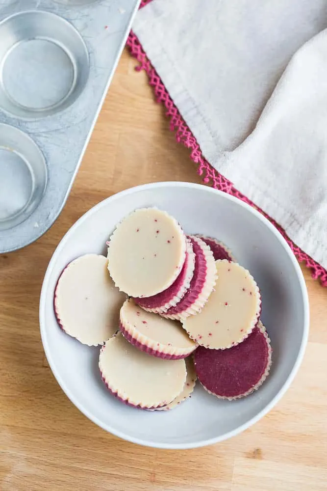 These keto friendly, sugar free fat bombs are the BEST little treat! The raspberry flavor is so strong and together they taste like a white chocolate raspberry truffle. Totally delicious. White Chocolate Raspberry Fat Bombs | The Everyday Ketogenic Kitchen | keto recipes | paleo recipes | dairy-free recipes | sugar free recipes | low carb recipes