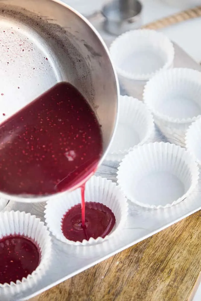 These keto friendly, sugar free fat bombs are the BEST little treat! The raspberry flavor is so strong and together they taste like a white chocolate raspberry truffle. Totally delicious. White Chocolate Raspberry Fat Bombs | The Everyday Ketogenic Kitchen | keto recipes | paleo recipes | dairy-free recipes | sugar free recipes | low carb recipes