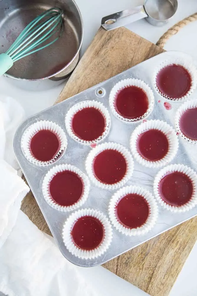 These keto friendly, sugar free fat bombs are the BEST little treat! The raspberry flavor is so strong and together they taste like a white chocolate raspberry truffle. Totally delicious. White Chocolate Raspberry Fat Bombs | The Everyday Ketogenic Kitchen | keto recipes | paleo recipes | dairy-free recipes | sugar free recipes | low carb recipes