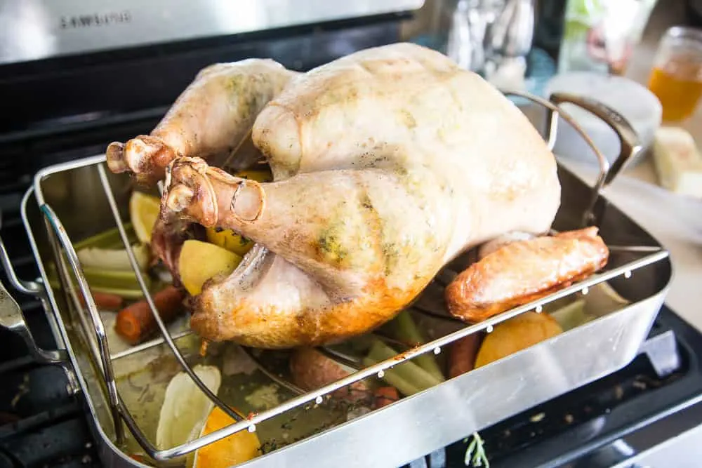Turkey, after being roasted for a while and flipped over so the breast side is up.
