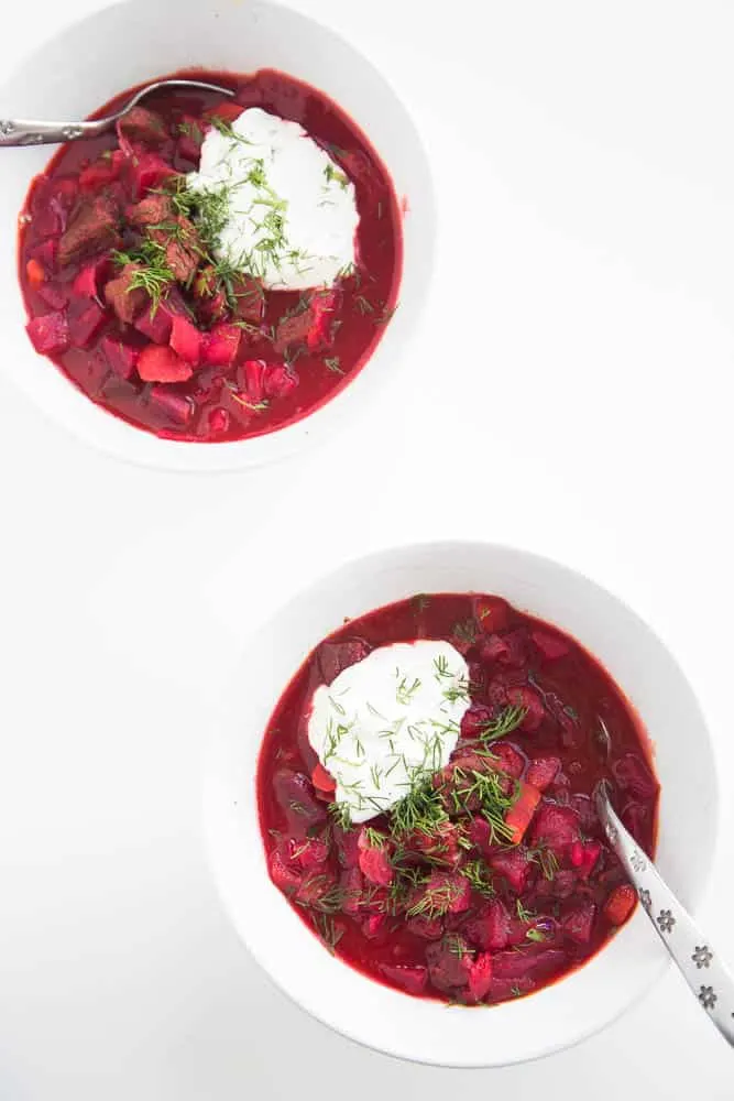 If you've never had borscht -- this is the recipe try first! Our kids go bonkers over this bright pink soup. | perrysplate.com #souprecipes #borscht #beefsoup Russia Palace's Borscht with fresh dill