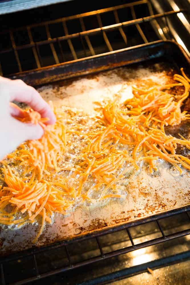 The secret of making crispy sweet potato hash browns is roasting them on a hot pan with plenty of bacon drippings or ghee. Step by step tutorial over at perrysplate.com! | sweet potato recipes | paleo recipes | Whole30 recipes