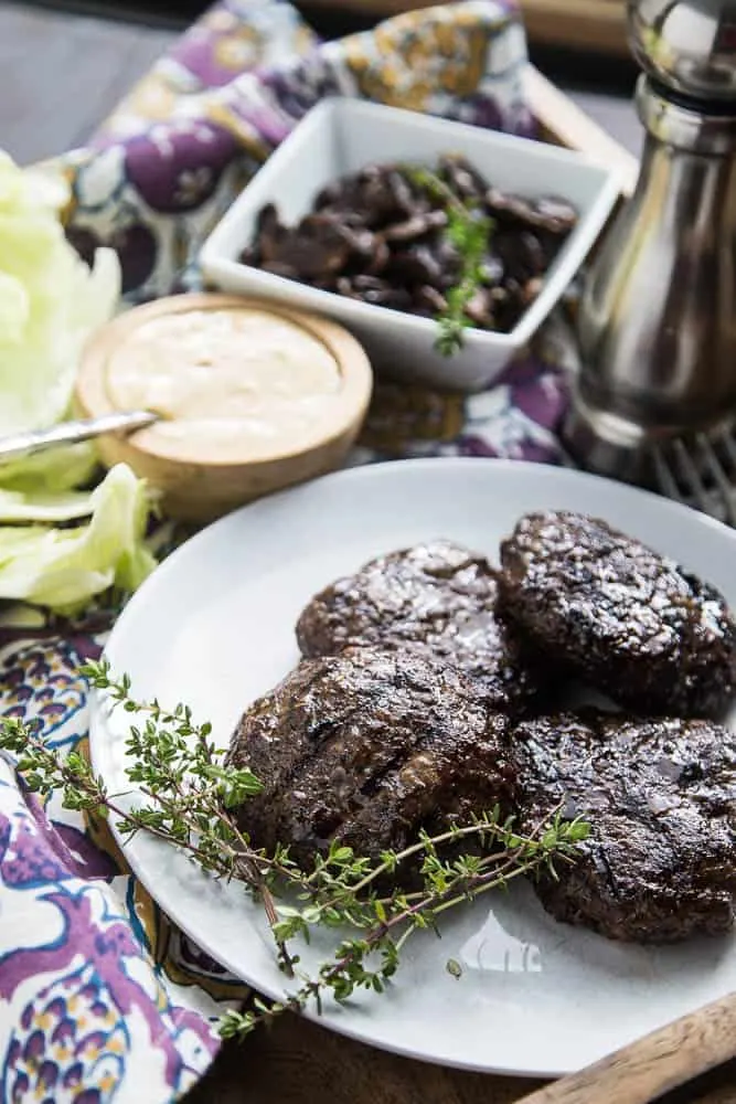 Double Mushroom Burgers with Roasted Garlic Aioli is a fabulous paleo & Whole30 friendly burger full of blended dried mushrooms! perrysplate.com