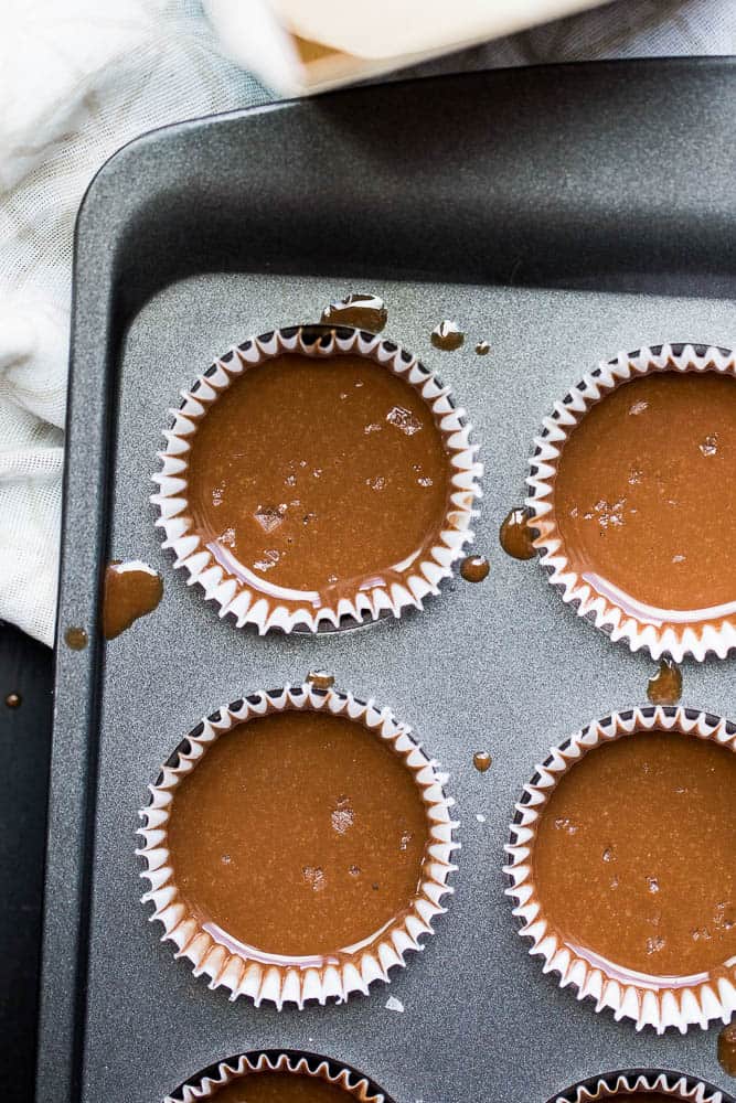 These little keto chocolate tahini fat bombs taste like a peanut butter cup without the nuts! They come together quickly and easily and will help keep your face out of the Reese's bag. | low-carb recipes | low carb high fat | perrysplate.com