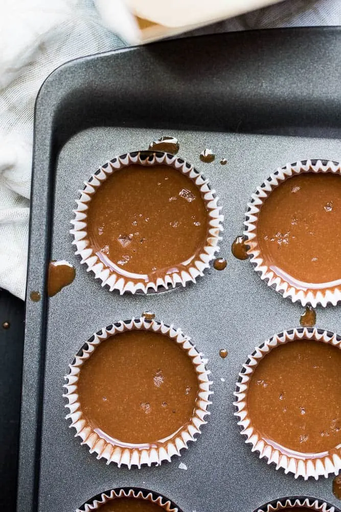 These little keto chocolate tahini fat bombs taste like a peanut butter cup without the nuts! They come together quickly and easily and will help keep your face out of the Reese's bag. | low-carb recipes | low carb high fat | perrysplate.com These little keto chocolate tahini fat bombs taste like a peanut butter cup without the nuts! They come together quickly and easily and will help keep your face out of the Reese's bag. | low-carb recipes | low carb high fat | perrysplate.com