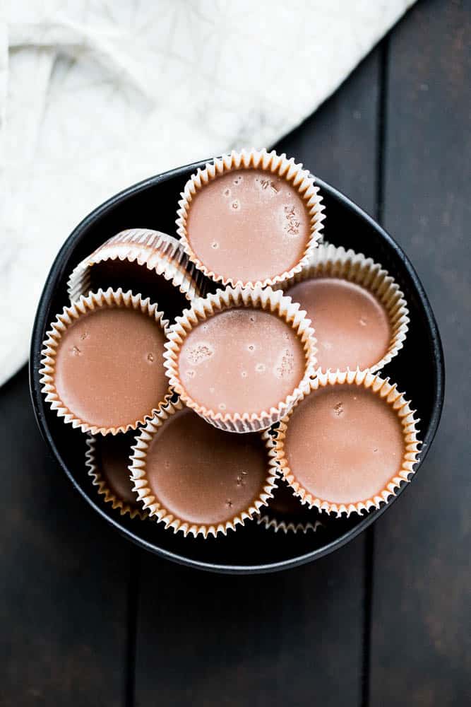 These little keto chocolate tahini fat bombs taste like a peanut butter cup without the nuts! They come together quickly and easily and will help keep your face out of the Reese's bag. | low-carb recipes | low carb high fat | perrysplate.com These little keto chocolate tahini fat bombs taste like a peanut butter cup without the nuts! They come together quickly and easily and will help keep your face out of the Reese's bag. | low-carb recipes | low carb high fat | perrysplate.com