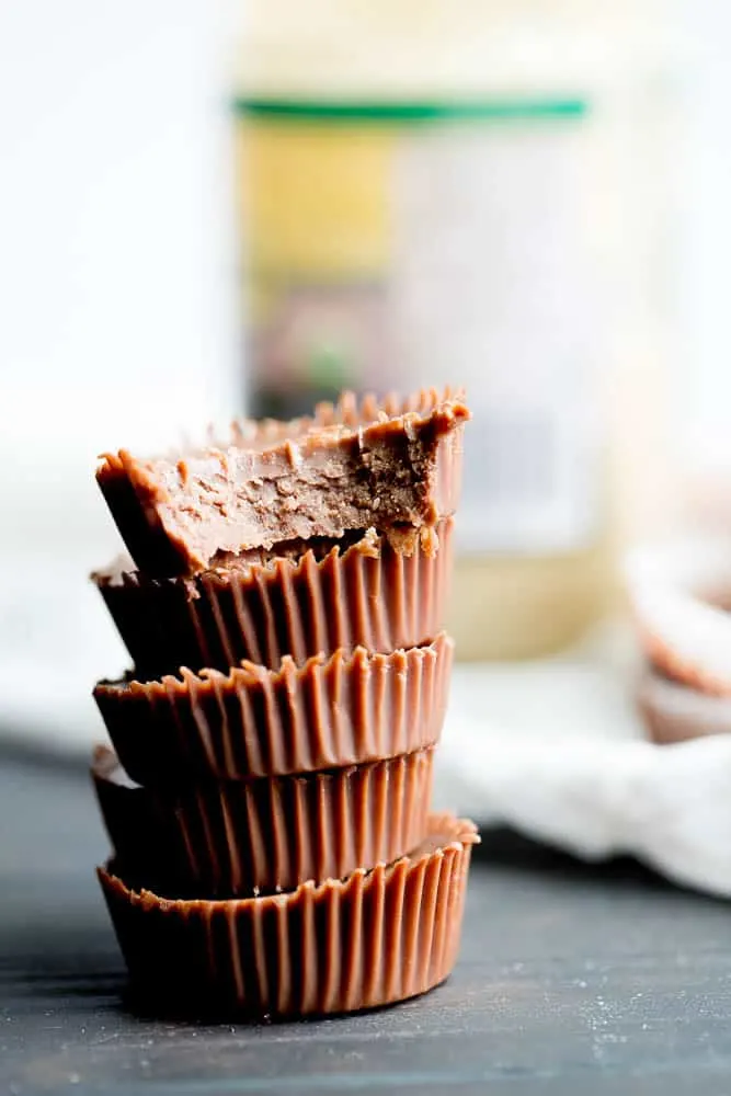 These little keto chocolate tahini fat bombs taste like a peanut butter cup without the nuts! They come together quickly and easily and will help keep your face out of the Reese's bag. | low-carb recipes | low carb high fat | perrysplate.com These little keto chocolate tahini fat bombs taste like a peanut butter cup without the nuts! They come together quickly and easily and will help keep your face out of the Reese's bag. | low-carb recipes | low carb high fat | perrysplate.com