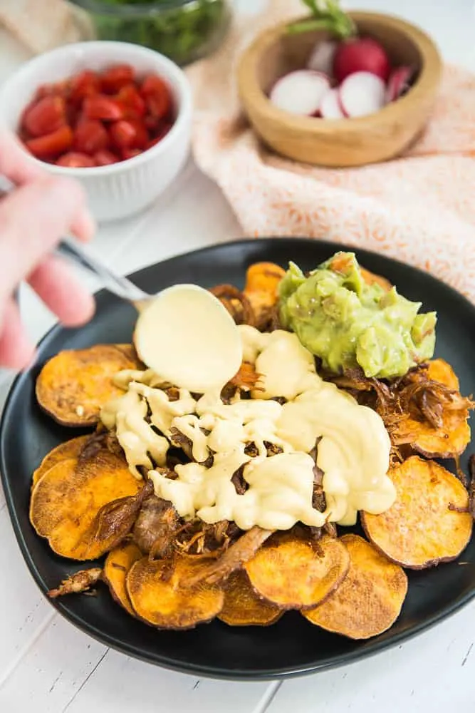 Chipotle Vegan Queso + Amazing Paleo Nachos | This dairy-free cashew cheese sauce is a snap and makes some seriously delicious paleo nachos! | perrysplate.com